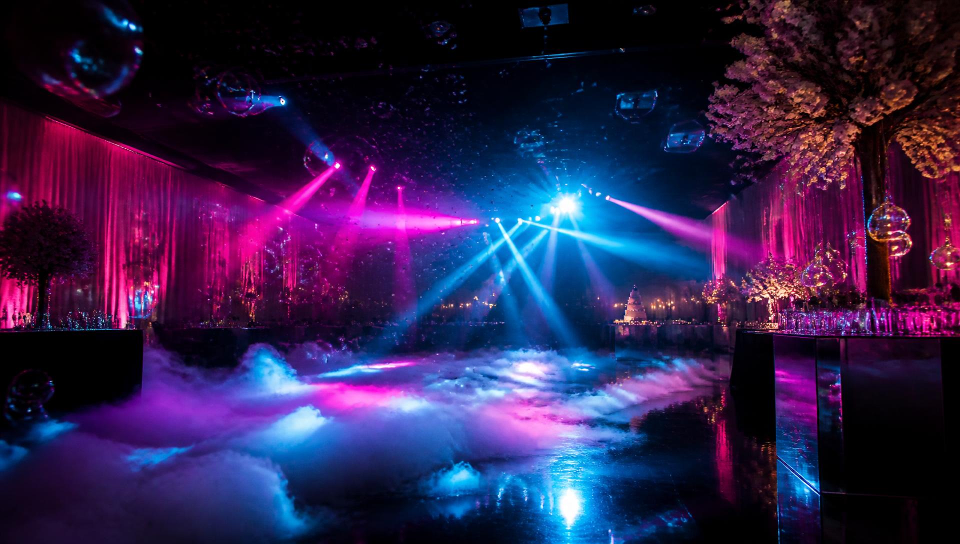 Party venue with fog effects, bubbles and colourful lighting